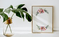 Floral golden frame by monstera leaves