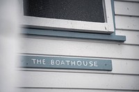 Closeup of  wooden boathouse sign 