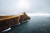 Seagull flying over the cliffs at Faroe Island