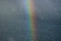 Rainbow after the rain over the Atlantic ocean in the Faroe Islands