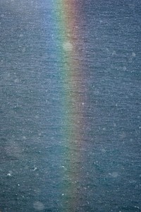 Rainbow after the rain over the Atlantic ocean in the Faroe Islands