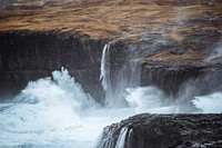 Stormy waves hitting the cliffs at Molin beach on Streymoy island, Faroe Islands