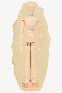 Wooden figure, toy on ripped paper