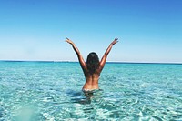 Free woman in blue ocean photo, public domain ocean CC0 image.