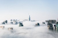 Skyscraper surrounded by clouds, free public domain CC0 photo