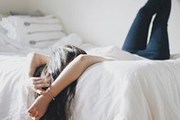 Girl lying in bed, free public domain CC0 image.