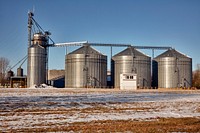 A row of metal grain silos in Michigan. Original image from <a href="https://www.rawpixel.com/search/carol%20m.%20highsmith?sort=curated&amp;page=1">Carol M. Highsmith</a>&rsquo;s America, Library of Congress collection. Digitally enhanced by rawpixel.