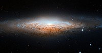 The NASA/ESA Hubble Space Telescope has spotted a UFO Galaxy, a NGC 2683, which is a spiral galaxy seen almost edge-on, giving it the shape of a classic science fiction spaceship. Original from NASA. Digitally enhanced by rawpixel.