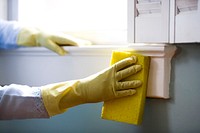 Woman using a damp sponge to clean dust collected on a window sill. Original image sourced from US Government department: Public Health Image Library, <a href="https://www.rawpixel.com/search/cdc?sort=curated&amp;page=1">Centers for Disease Control and Prevention</a>. Under US law this image is copyright free, please credit the government department whenever you can&rdquo;.
