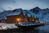 Orange cabins by the lake in Ballstad village, Norway
