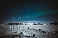 Northern lights over snowy Greenland