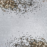 Gold glitter confetti on a silver background 