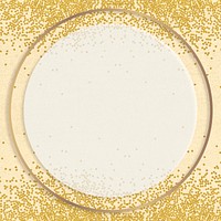 Gold shimmering round frame design element on a yellow background