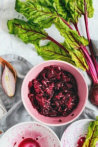 Freshly diced beetroot in a cup food photography aerial view