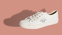 Unisex white sneakers mockup on a pink background