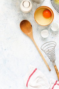 Baking utensils and ingredients on a white background