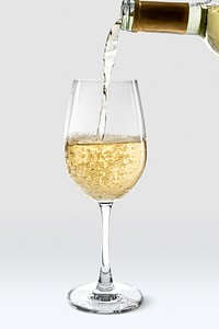 Pouring sparkling wine into wine glass psd