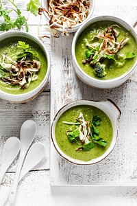 Homemade broccoli soup with horseradish and parsley chips