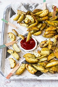 Potato wedges with ketchup on a tray