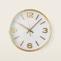 Round gold analog clock hanging on a wall