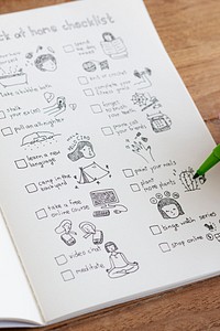 Social isolation doodle style checklist in a notebook