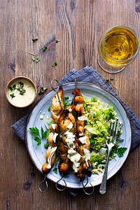 Grilled chicken skewers and green salad menu recipe idea