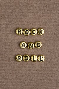 ROCK AND ROLL beads word typography on texture background