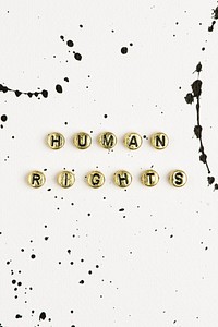Gold human rights beads text lettering typography 