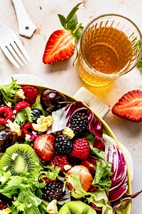 Healthy salad bowl with veggies and berries