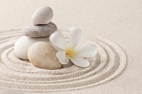 Stacked zen stones sand background art of balance concept