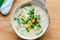 Kids healthy chicken soup with peas and carrots 