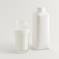 Fresh milk in a glass with a bottle