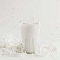 Fresh milk splashing from a glass