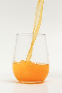 Pouring fresh organic orange juice into a glass