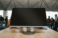 Computer screen on a wooden table at the airport