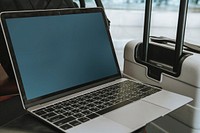 Laptop by a luggage in the airport