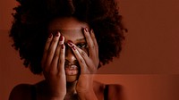 Black woman with afro hair covering her face with hands social template