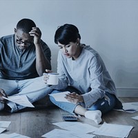 Couple managing their debt due to COVID-19