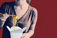 Woman eating a box spaghetti