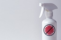Alcohol sanitizer in a white spray bottle