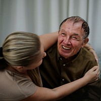 Daughter taking care of her elderly father