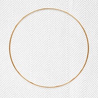 Round gold frame on a white textured background