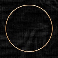 Round gold frame on a black textured background