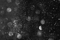 White glitter pattern on a black background