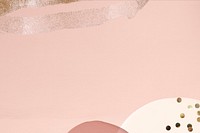 Gold glitter on dull pink background