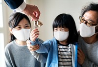 Japanese family in face mask buying a new house