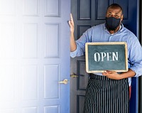 Black business owner in mask during new normal post pandemic