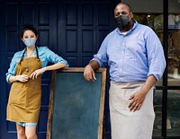 Business owners in face mask at cafe