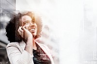 Young business woman on phone over city background