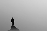 Man standing on top of a hill